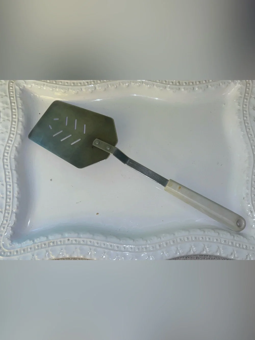 Vintage Ace kitchen spatula turner with decorative blue folk art handle